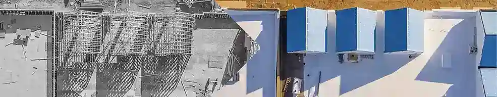 Overhead view of one Maricopa County home: bare framing on the left, completed roof on the right